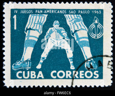 CUBA - CIRCA 1963: A stamp printed in Cuba dedicated to Pan American Games in Sao Paulo, Brazil, shows  baseball Stock Photo