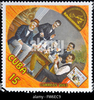 CUBA - CIRCA 2003: A stamp printed in Cuba dedicated to the wine shows a gathering of friends drinking, circa 2003 Stock Photo