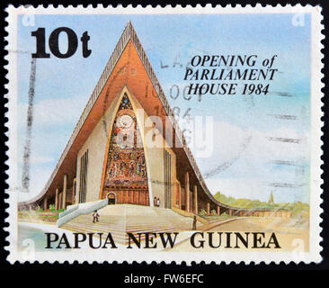 PAPUA NEW GUINEA - CIRCA 1984: A stamp printed in Papua shows opening of parliament house, circa 1984 Stock Photo