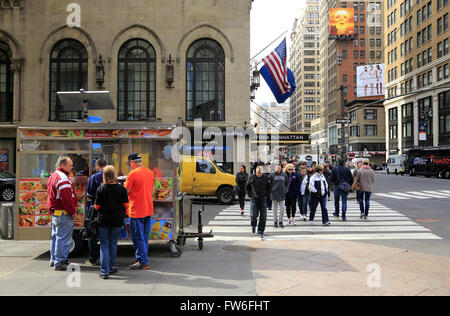 Food cart selling hot dog,pretzel and soft drink on street of midtown Manhattan, New York City,USA Stock Photo