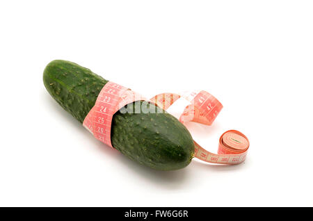 Cucumber and measuring tape isolated on white Stock Photo