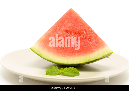 slice of watermelon with a triangle shaped on plate Stock Photo