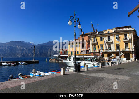 View of Malcesine town center and small port. Malcesine is located on the eastern shore of Lake Garda in the Province of Verona Stock Photo