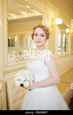 Portrait of the beautiful bride in a bright room Stock Photo