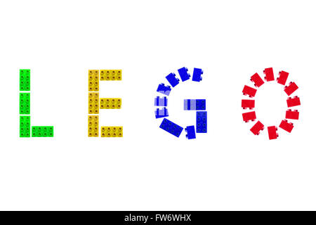 The word LEGO created from green, yellow, blue and red Lego blocks against a white background. Stock Photo