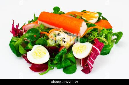 Frise Corn Salad with Chicory, Escarole, Crab Sticks and Quail E Stock Photo