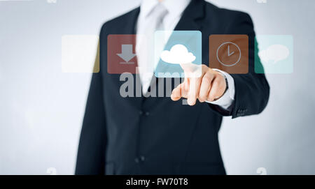 close up of man pointing finger to cloud icon Stock Photo