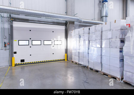 warehouse door or gate and cargo boxes Stock Photo