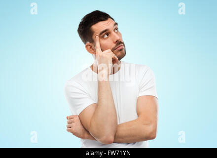 man thinking over blue background Stock Photo