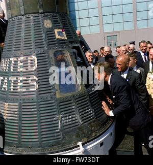 U.S. President John F. Kennedy and Astronaut John Glenn look into the Mercury Friendship 7 space capsule that carried Glenn into space at the Cape Canaveral Air Force Base February 23, 1962 in Cocoa Beach, Florida. Glenn was awarded Distinguished Service Medal by the President following his historic flight. Those looking on include: Special Assistant to the President Lawrence Larry O'Brien; Senator George Smathers of Florida; Director of the Manned Spacecraft Center Dr. Robert Gilruth.  Please credit 'Cecil Stoughton, White House/John F. Kennedy Presidential Library and Museum, Boston' Stock Photo