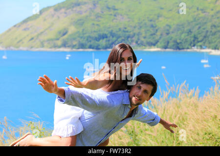 Cheerful couple having fun on vacation at seaside Stock Photo