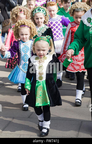 Girls dressed in Traditional Irish clothing for the St Patrick's Day Parade in London England Stock Photo