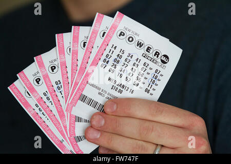 A man holds several Powerball tickets in Kingston, Ont., on Thursday Jan. 14, 2016. Stock Photo