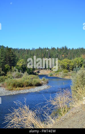 A view of trout fishing on the Smith River next to US-199 near Gasquet, California. Stock Photo