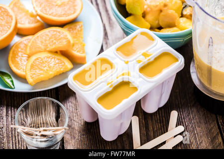 Making popsicle from exotic fruits and juice Stock Photo