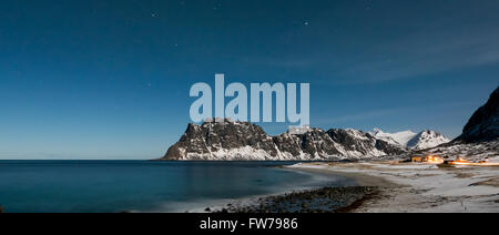 Northern lights over the sea at Utakleiv Beach, Lofoten Islands, Norway in the winter. Stock Photo