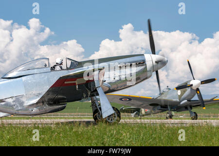 North American Aviation P-51D Mustang (D-FPSI) World War II fighter aircraft with a Supermarine Spitfire in the background Stock Photo