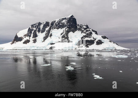 Scenic landscape of mountains and glaciers in the Neumayer Channel of the Antarctic Peninsula. Stock Photo