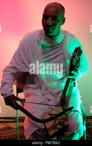 Ethiopian man playing the masenqo also spelled masenko, mesenqo