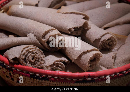 Roll of Injera roll which is a sourdough-risen flatbread with a unique, slightly spongy texture. Traditionally made out of teff flour. National dish in Ethiopia and Eritrea Stock Photo