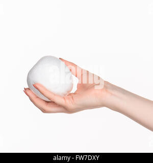 The female hand holding white blank styrofoam oval against the white background  with right shadow Stock Photo