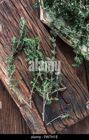 Garden fresh Thyme on rustic board, view from overhead Stock Photo