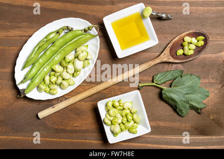 Fresh green beans seen from above on a rough wood floor brown color ...