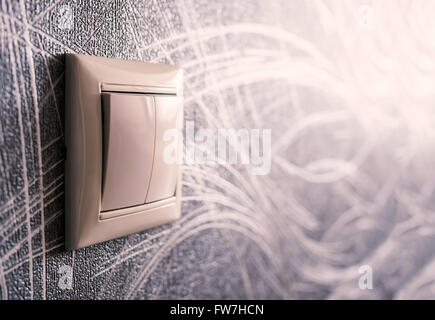 Light switch on the wall, shallow depth of field Stock Photo