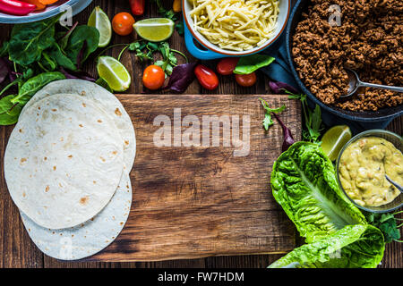 Mexican street simple street food, tortillas with minced beef and guacamole. Stock Photo