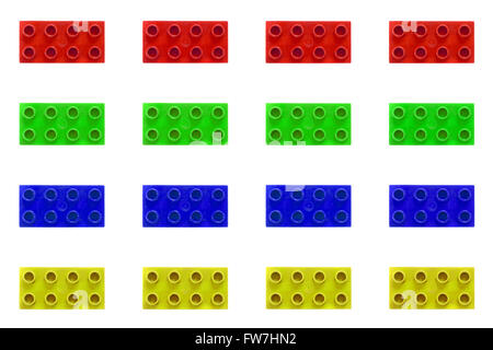 A grid of different coloured Lego pieces against a white background. Stock Photo