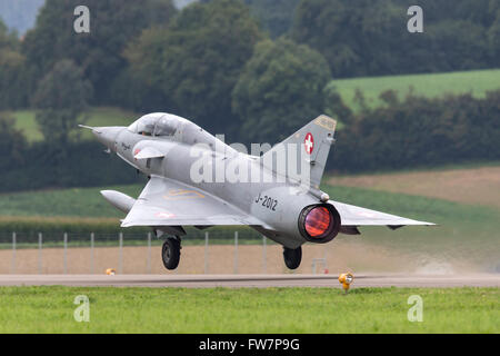 Former Swiss Air Force Dassault Mirage III DS fighter aircraft HB-RDF (J-2012) takes off with full afterburner (reheat). Stock Photo