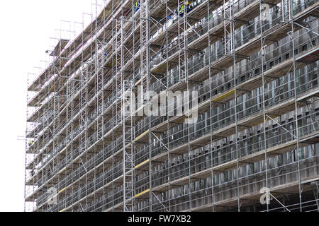 huge building facade with scaffolding - construction site Stock Photo