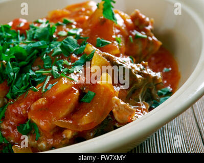 Chicken Marengo -  French dish consisting of a chicken  oil with garlic and tomato. Stock Photo