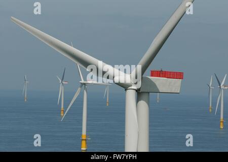 Offshore wind turbines at the Greater Gabbard wind farm off the coast of Suffolk, England. The alternative energy project was completed in 2012 at a cost of $2 billion dollars. Stock Photo