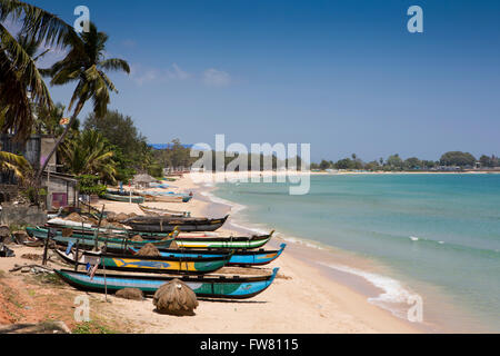 Sri Lanka, Trincomalee, Dutch Bay, colourful fishing boats on the empty beach Stock Photo