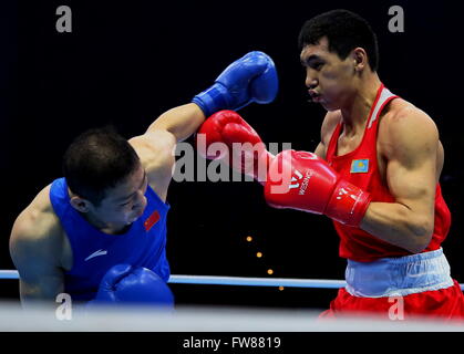 Qian'an, China's Hebei Province. 1st Apr, 2016. Zhao Minggang (L) of China competes against Zhanibek Alimkhanuly of Kazakhstan during the final match of the men's 75kg category competition at the Asia/Oceania Zone boxing event qualifier for 2016 Rio Olympic Games in Qian'an, north China's Hebei Province, April 1, 2016. Credit:  Yang Shiyao/Xinhua/Alamy Live News Stock Photo