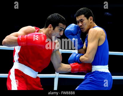 Qian'an, China's Hebei Province. 1st Apr, 2016. Shakhram Giyasov (L) of Uzbekistan competes against Saylom Ardee of Thailand during the final match of the men's 69kg category competition at the Asia/Oceania Zone boxing event qualifier for 2016 Rio Olympic Games in Qian'an, north China's Hebei Province, April 1, 2016. Credit:  Yang Shiyao/Xinhua/Alamy Live News Stock Photo