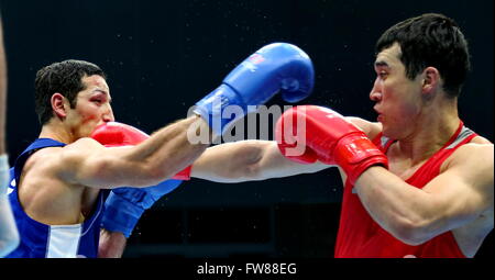 Qian'an, China's Hebei Province. 1st Apr, 2016. Elshod Rasulov (L) of Uzbekistan competes against Adilbek Niyazymbetov of Kazakhstan during the final match of the men's 81kg category competition at the Asia/Oceania Zone boxing event qualifier for 2016 Rio Olympic Games in Qian'an, north China's Hebei Province, April 1, 2016. Credit:  Yang Shiyao/Xinhua/Alamy Live News Stock Photo