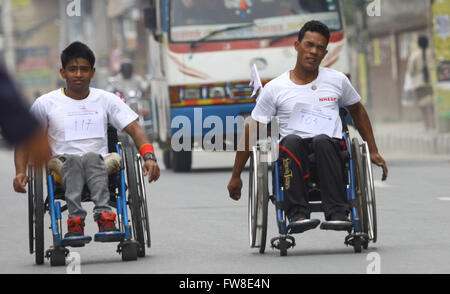 Kathmandu, Nepal. 2nd Apr, 2016. Disabled people compete in a 5km wheelchair race in Kathmandu, Nepal, April 2, 2016. The race is organized to support and encourage earthquake survivors and motivate them in the society. Credit:  Sunil Sharma/Xinhua/Alamy Live News Stock Photo