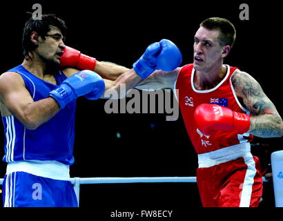 Qian'an, China's Hebei Province. 2nd Apr, 2016. Jason Eric Whateley (R) of Australia competes against Jakhon Qurbonov of Tajikistan during the play-off match of the men's 91kg category competition at the Asia/Oceania Zone boxing event qualifier for 2016 Rio Olympic Games in Qian'an, north China's Hebei Province, April 2, 2016. © Yang Shiyao/Xinhua/Alamy Live News Stock Photo
