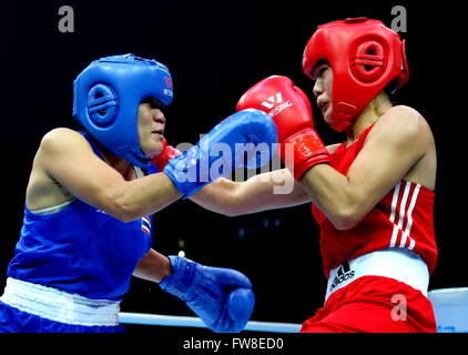 Qian'an, China's Hebei Province. 2nd Apr, 2016. Luu Thi Duyen (R) of Vietnam competes against Tassamalee Thongjan of Thailand during the play-off match of the women's 57-60kg category competition at the Asia/Oceania Zone boxing event qualifier for 2016 Rio Olympic Games in Qian'an, north China's Hebei Province, April 2, 2016. © Yang Shiyao/Xinhua/Alamy Live News Stock Photo
