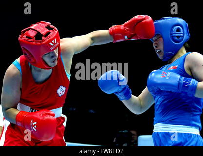 Qian'an, China's Hebei Province. 2nd Apr, 2016. Chen Nien-Chin (L) of Chinese Taipei competes against Jang Un Hui of Democratic People's Republic of Korea during the play-off match of the women's 69-75kg category competition at the Asia/Oceania Zone boxing event qualifier for 2016 Rio Olympic Games in Qian'an, north China's Hebei Province, April 2, 2016. Chen won the match 2-0. © Yang Shiyao/Xinhua/Alamy Live News Stock Photo