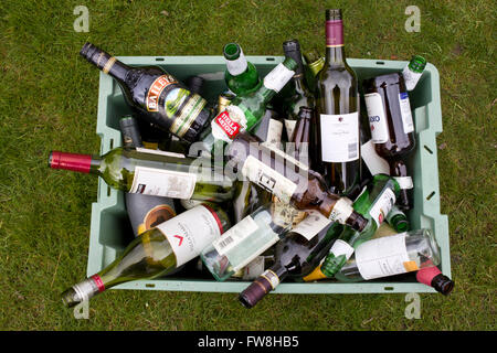 Empty wine & beer bottles in a crate ready for recycling Stock Photo