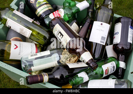 Empty wine & beer bottles in a crate ready for recycling Stock Photo