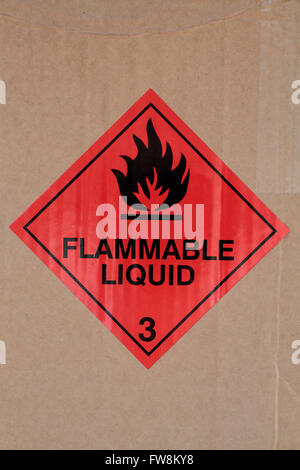 A flammable liquid hazchem warning label on the packaging of a delivery of chemicals to a UK high school. Stock Photo