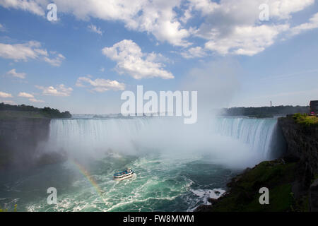 The Maid of the mist tour boat drives near the Canadian Horseshoe Falls in Niagara Falls Ont., on Tuesday July 28, 2015. Stock Photo