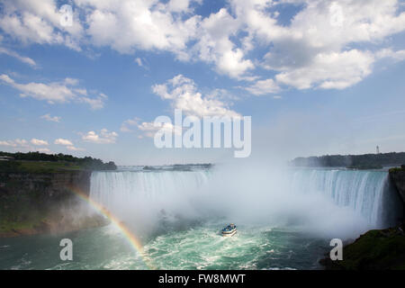 The Maid of the mist tour boat drives near the Canadian Horseshoe Falls in Niagara Falls Ont., on Tuesday July 28, 2015. Stock Photo