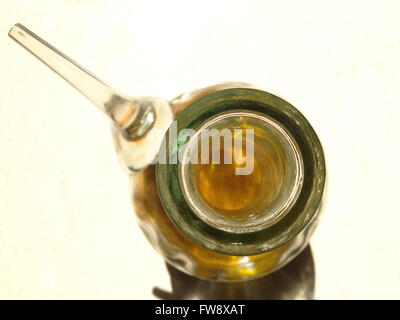 Glass oil cruet isolated over white background. High view Stock Photo