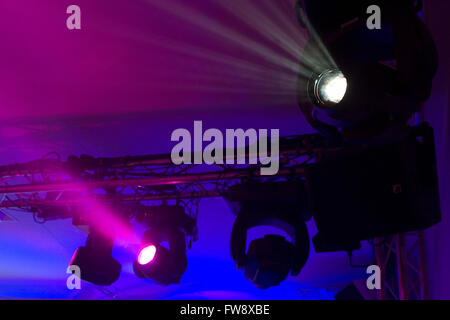 Detail of a stage lighting rig or set up similair to set ups that are used in theatre and conference lighting to change the mood and atmosphere at events. Stock Photo