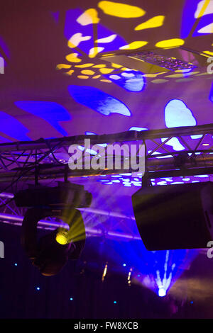 Detail of a stage lighting rig or set up similair to set ups that are used in theatre and conference lighting to change the mood and atmosphere at events. Stock Photo